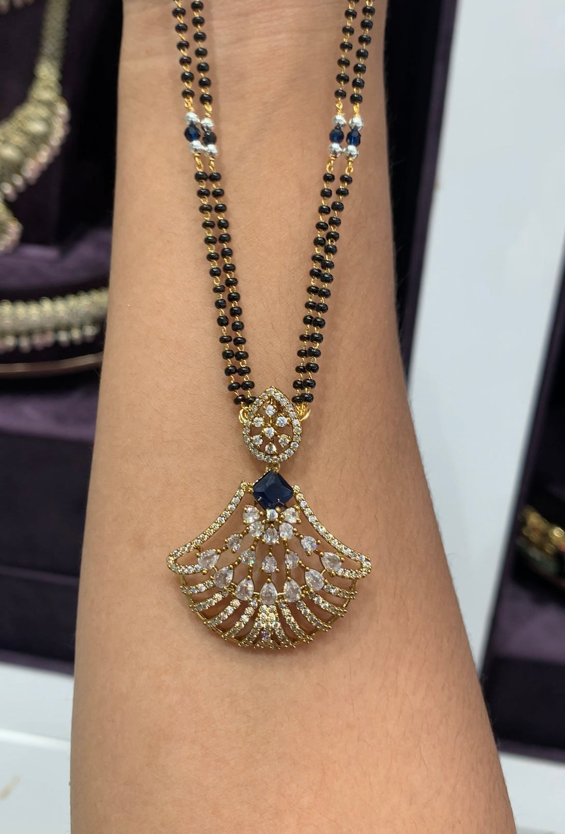 Beautiful blue stone locket set with black beads