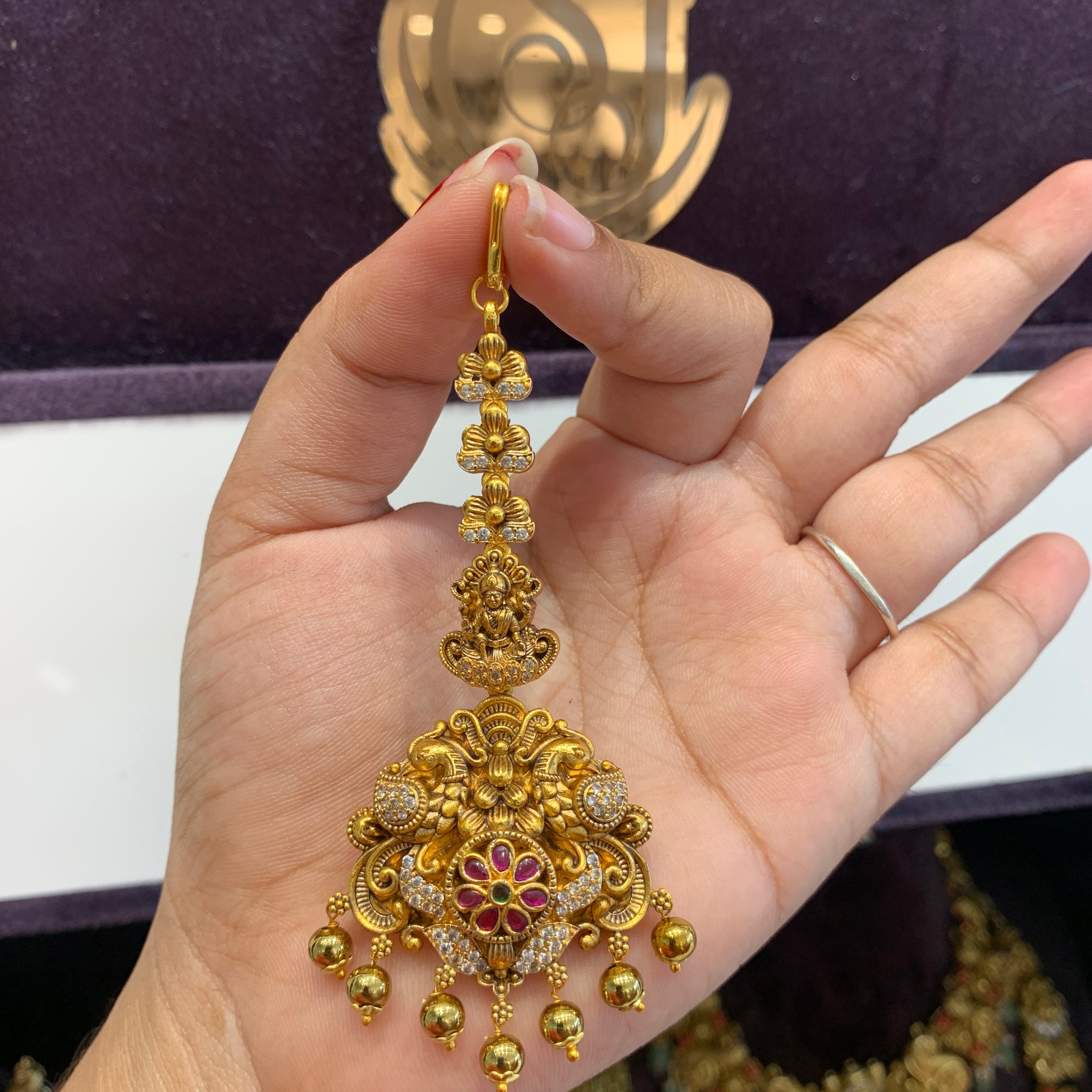 Beautiful Nakshi tikka with gold beads