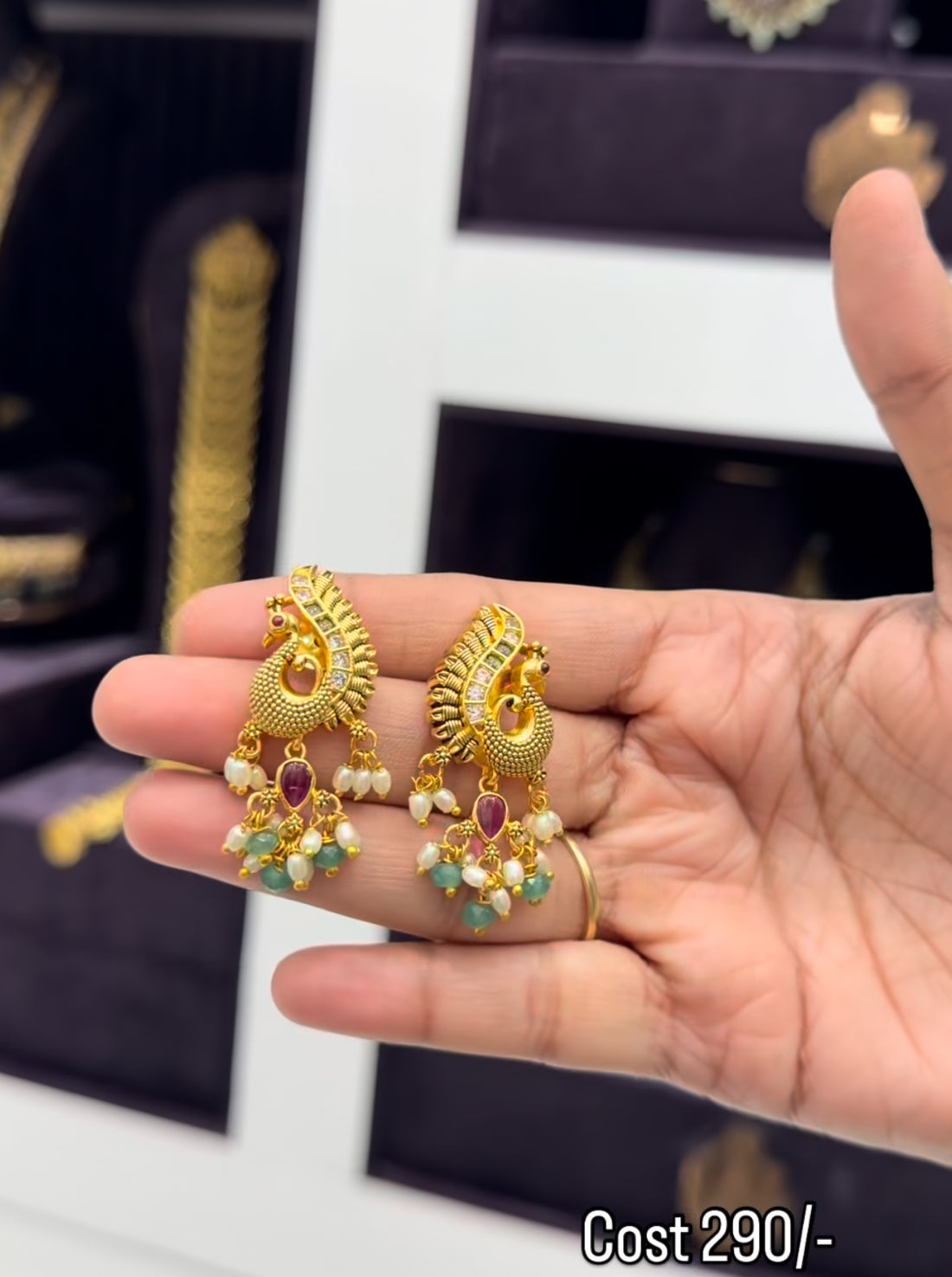 Beautiful peacock studs