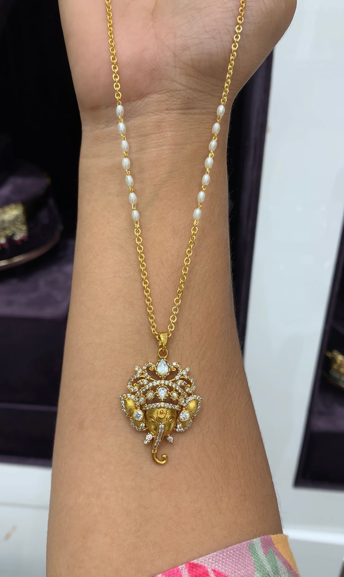 Beautiful Vinayaka locket with chain and rice roll combination