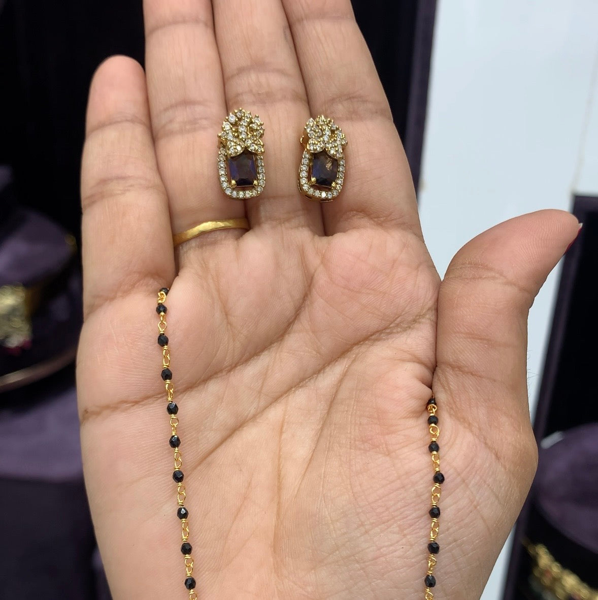 Beautiful purple stone locket set with black beads