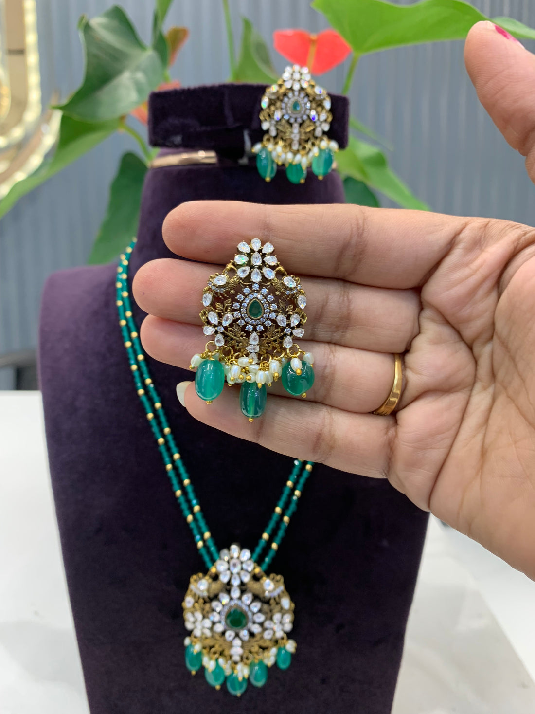 Beautiful peacock pendent set with Green crystals Danda