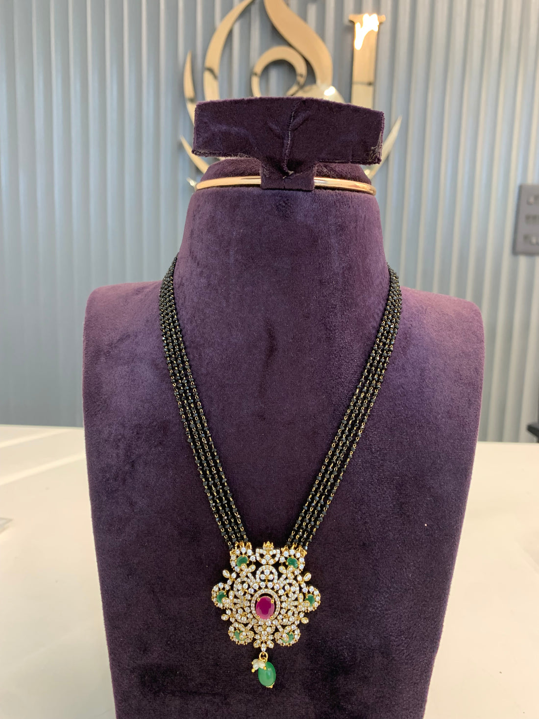 Premium 4 line crystal black beads with Multi stones pendent