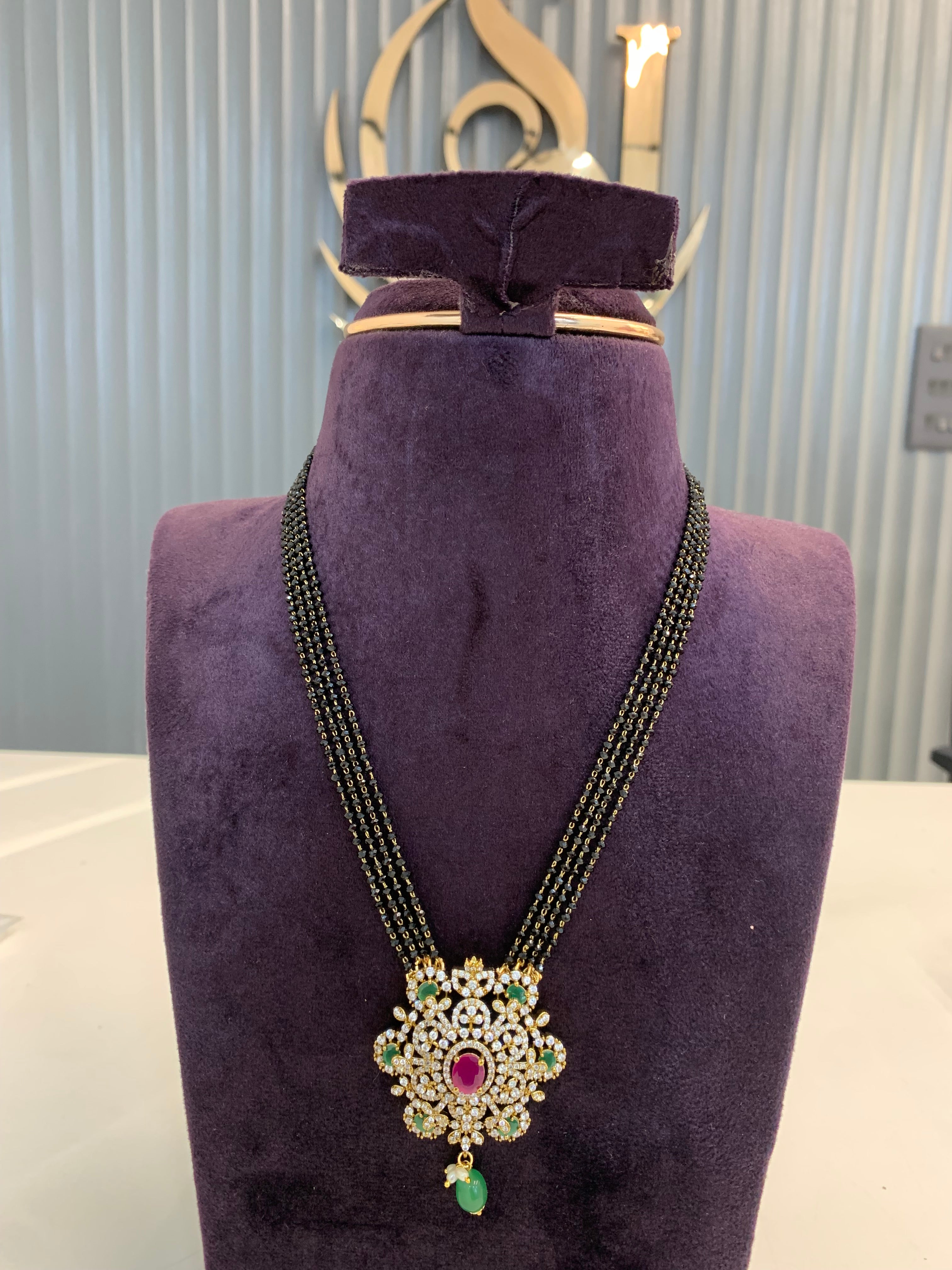 Premium 4 line crystal black beads with Multi stones pendent