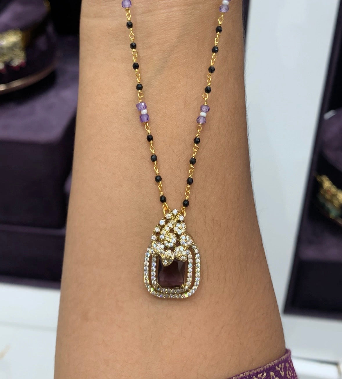Beautiful purple stone locket set with black beads