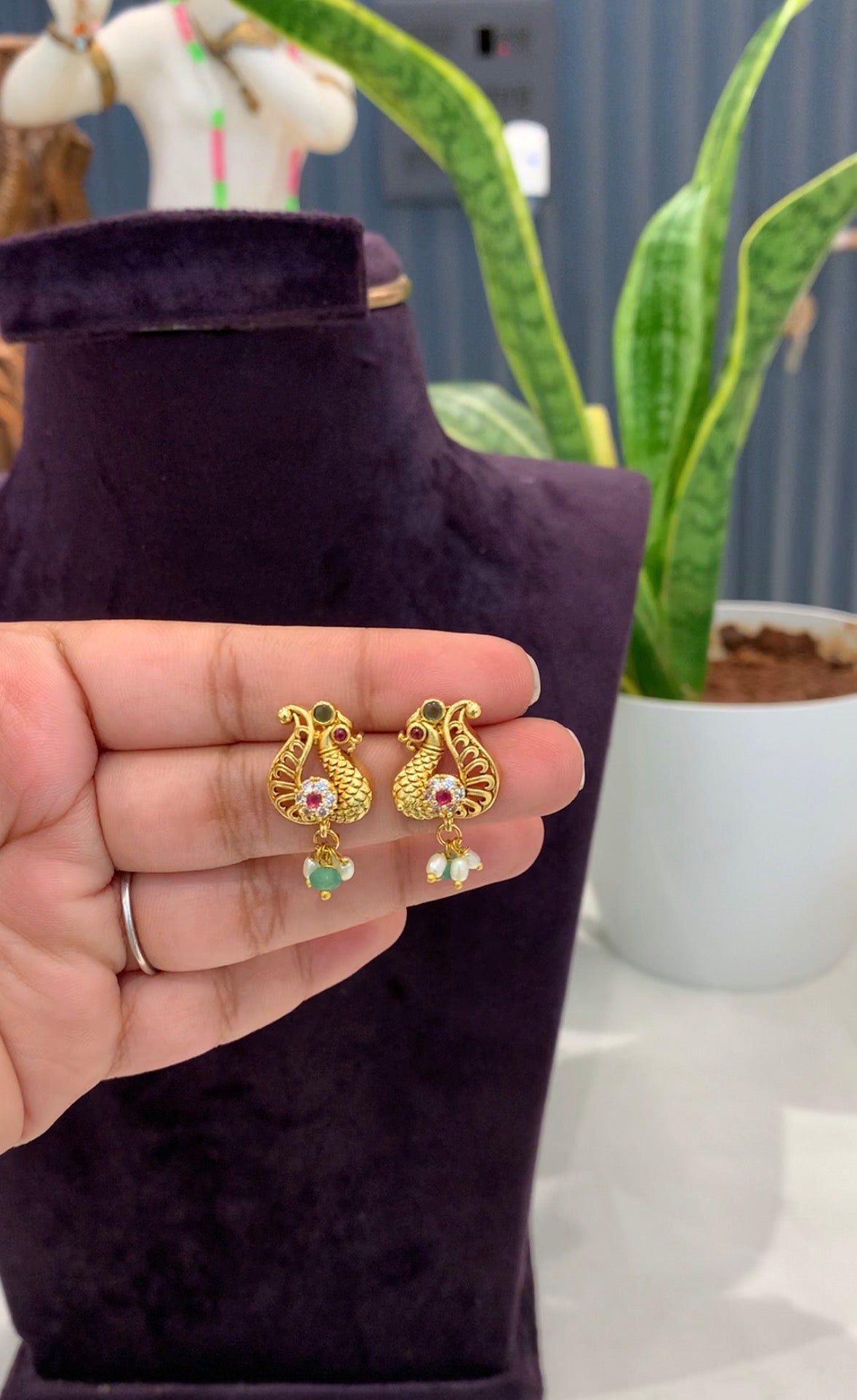Beautiful peacock studs