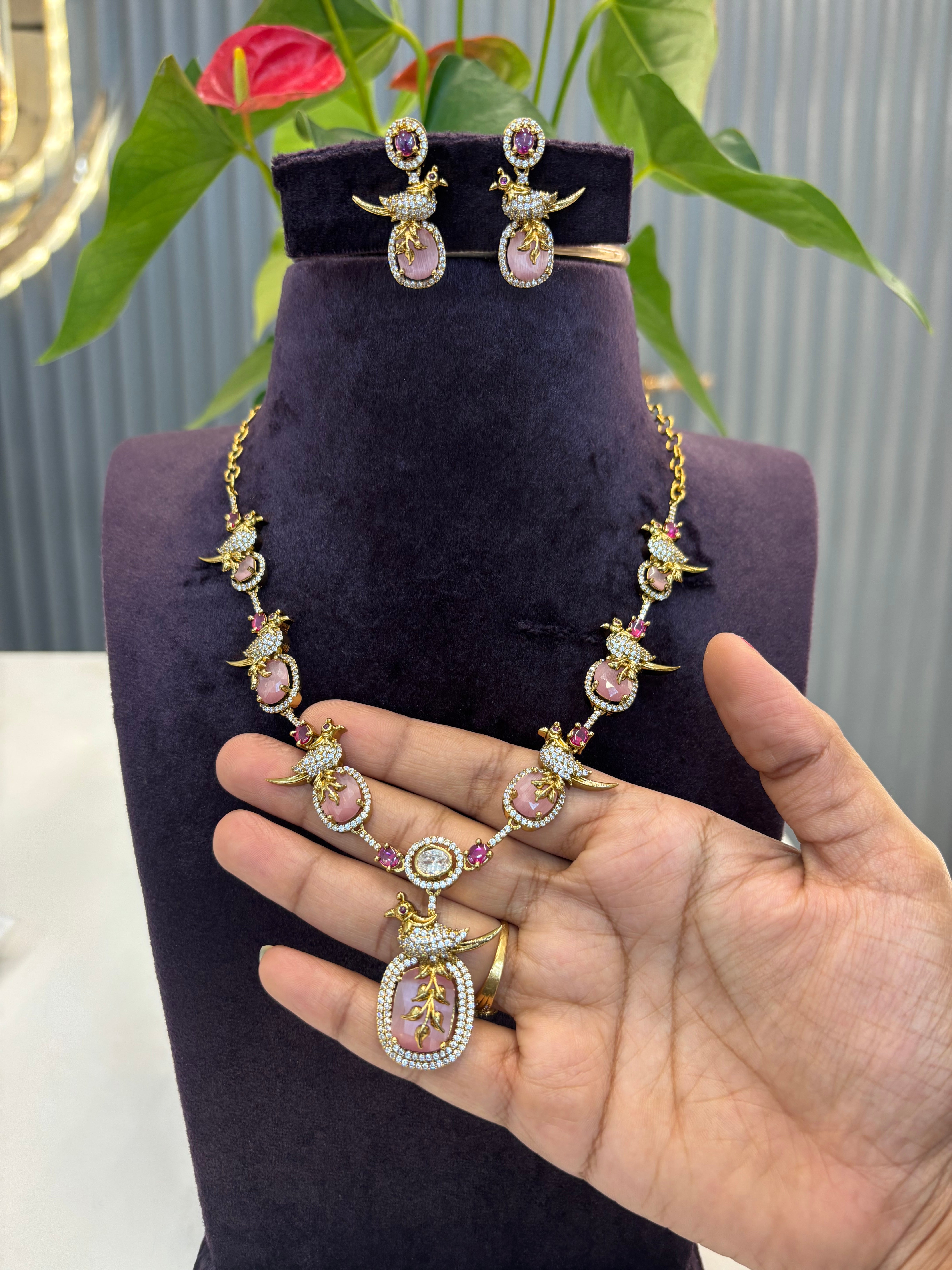Beautiful pastelsl Pink stone parrot necklace