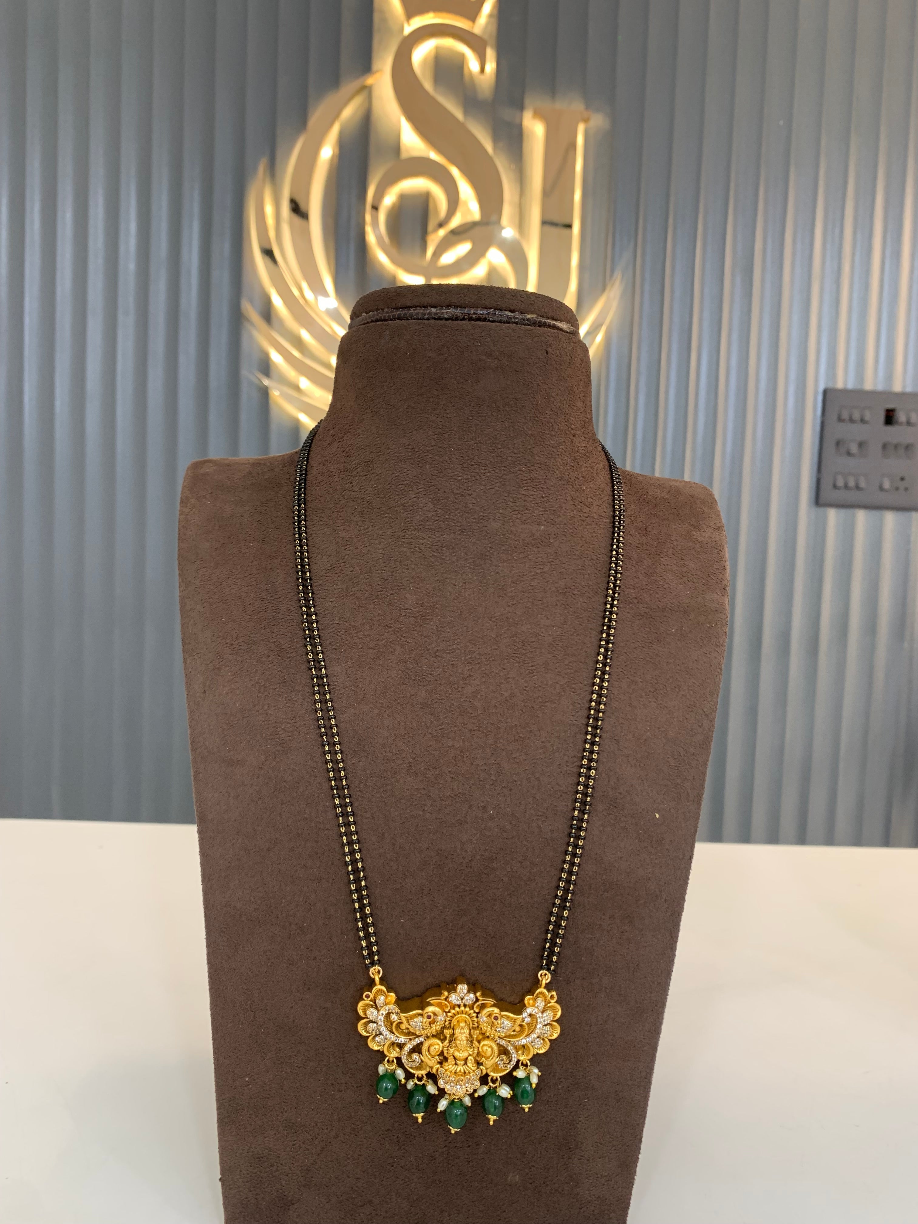 Beautiful long black beads with Nakshi locket