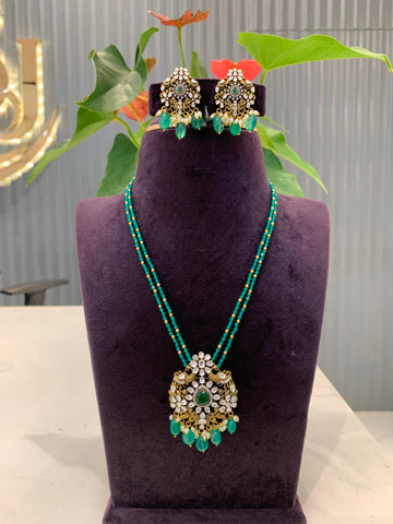 Beautiful peacock pendent set with Green crystals Danda