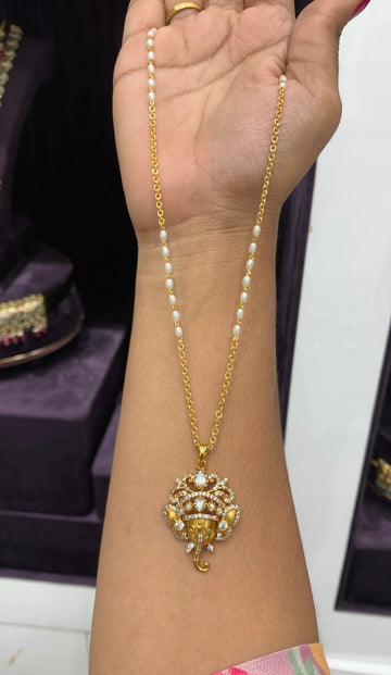 Beautiful Vinayaka locket with chain and rice roll combination