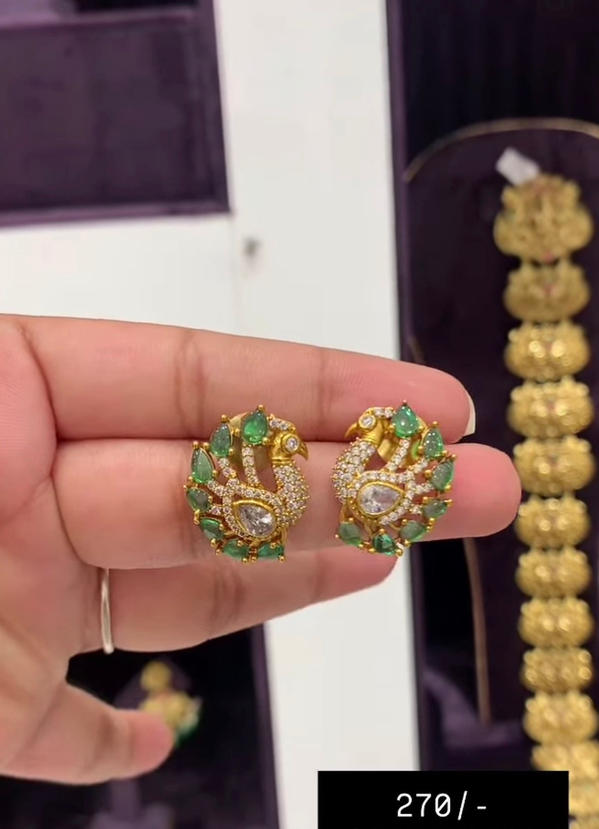 Beautiful peacock studs