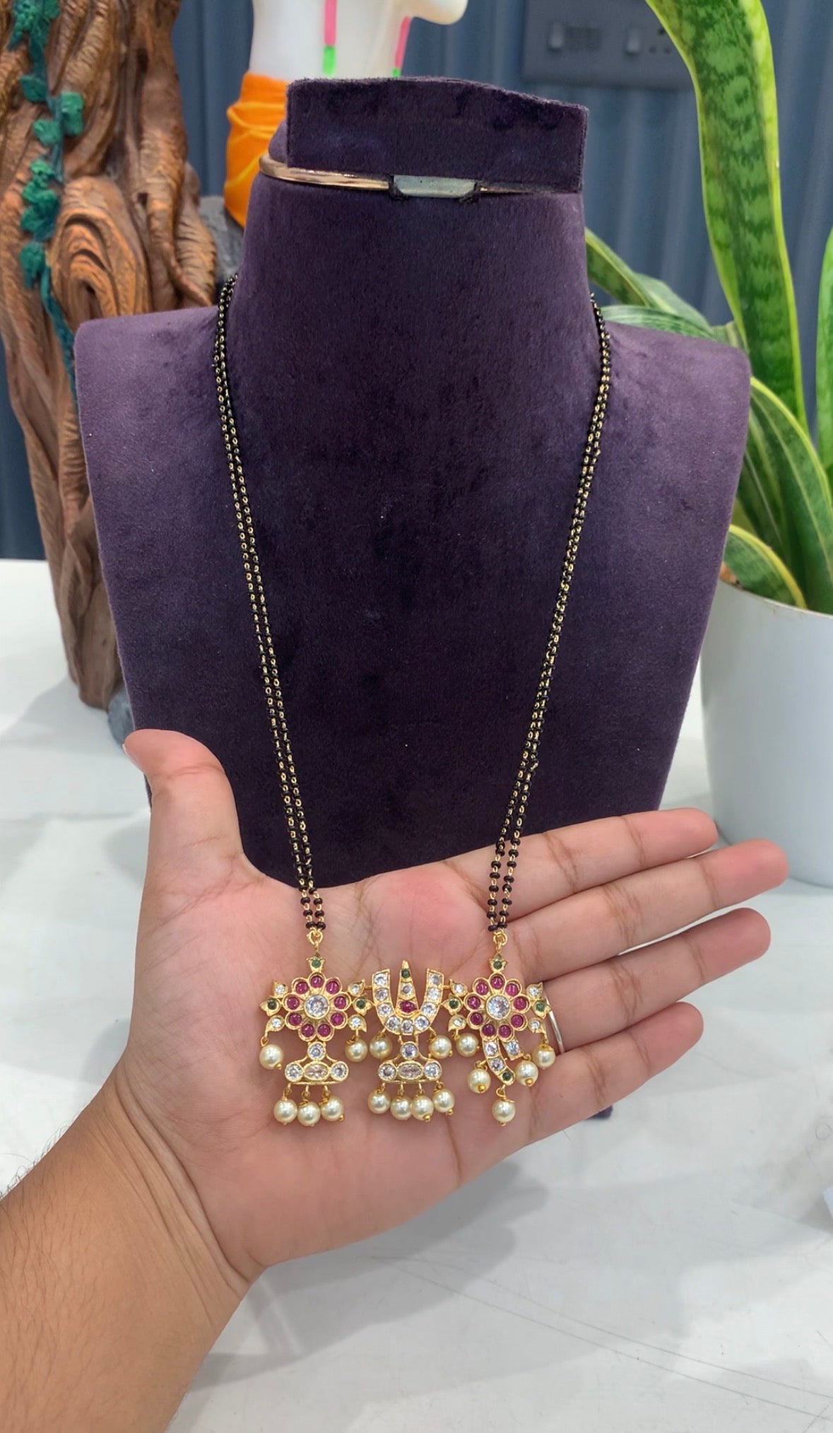 Beautiful customised 24inchs blackbeads with shankuchakrala pendant