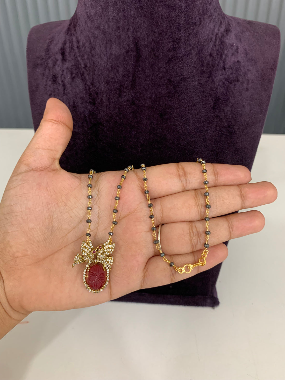 Trendy gun metal black beads with ruby pendent