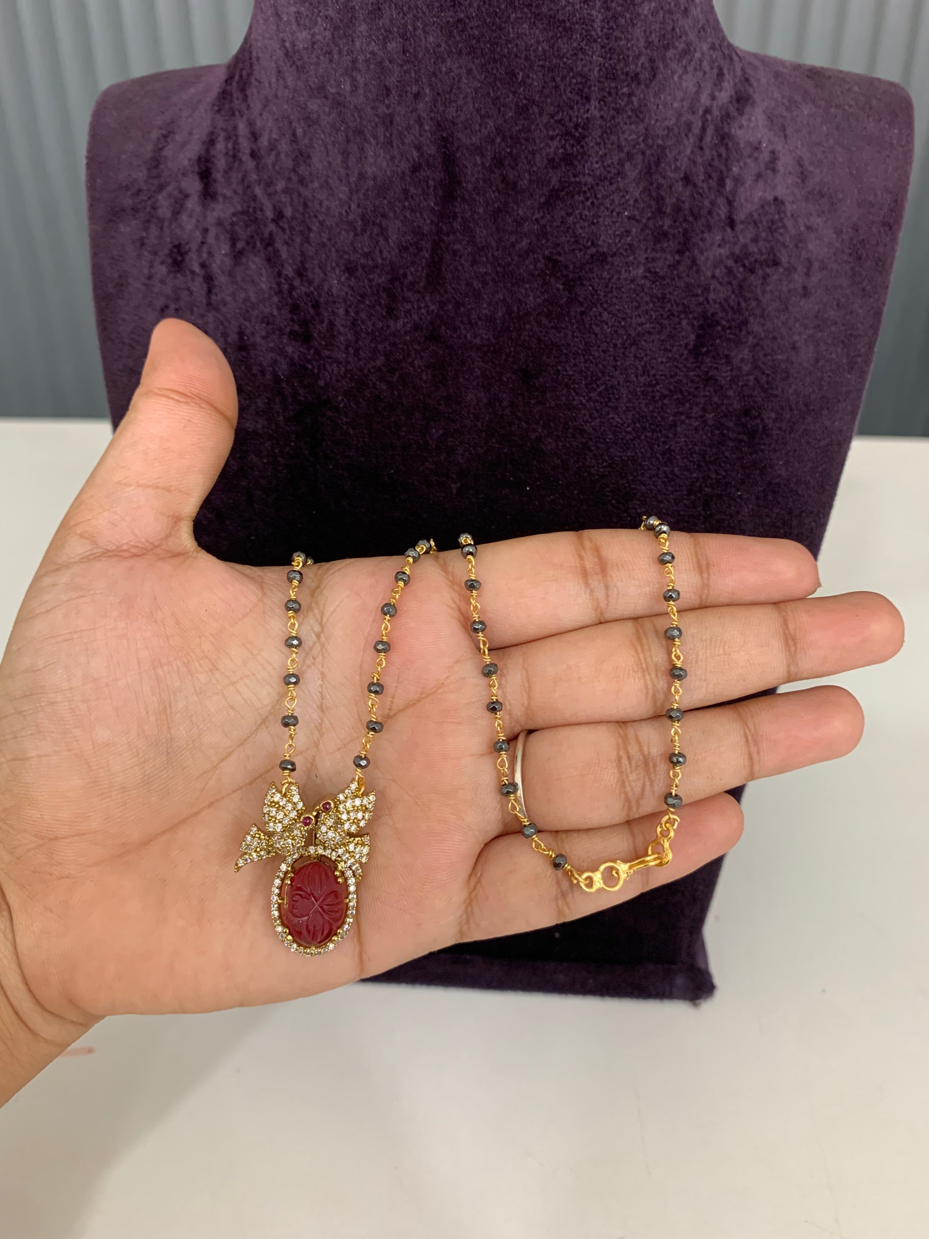 Trendy gun metal black beads with ruby pendent