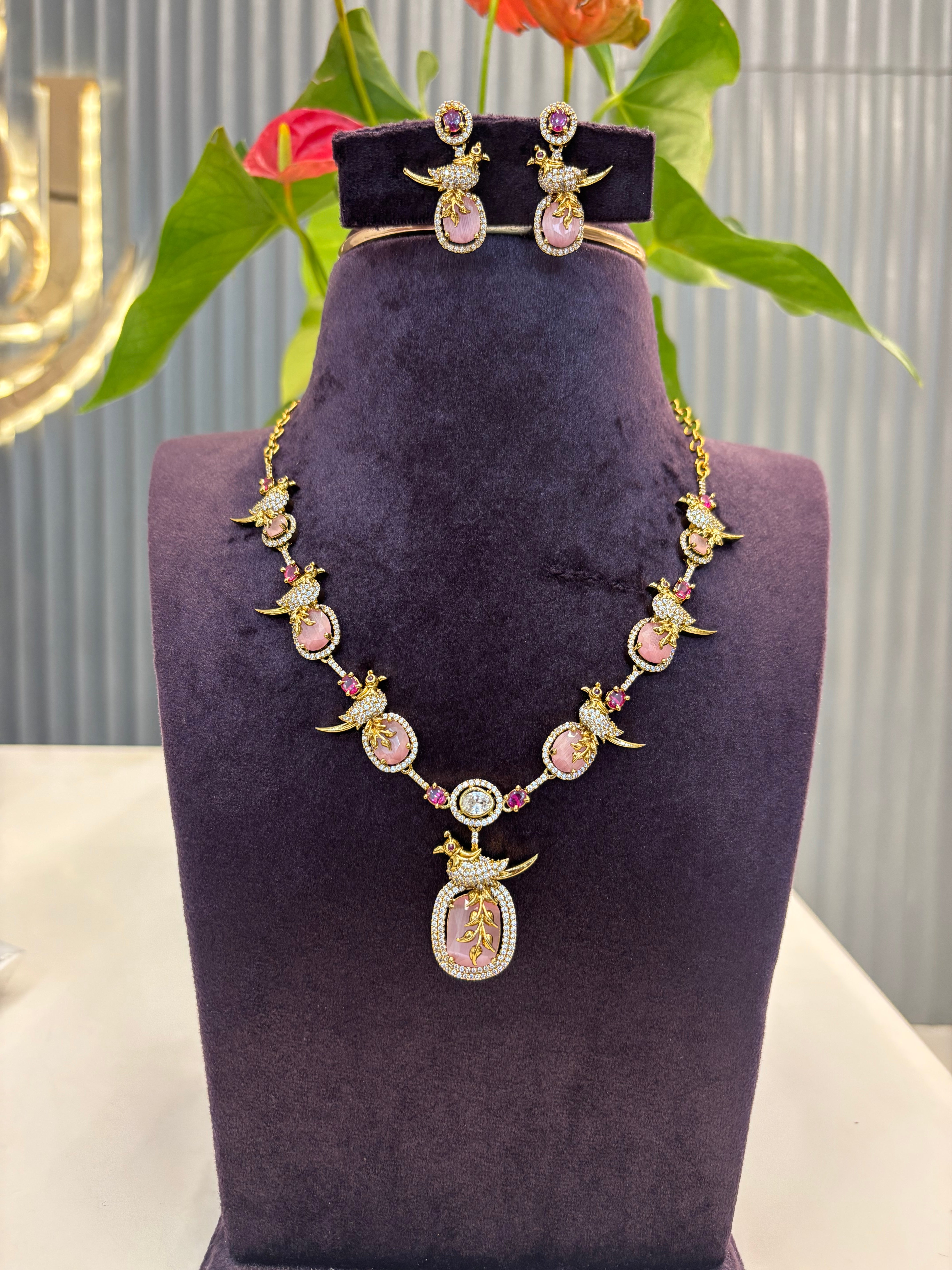 Beautiful pastelsl Pink stone parrot necklace