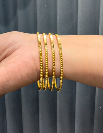 Beautiful gold replica bangles