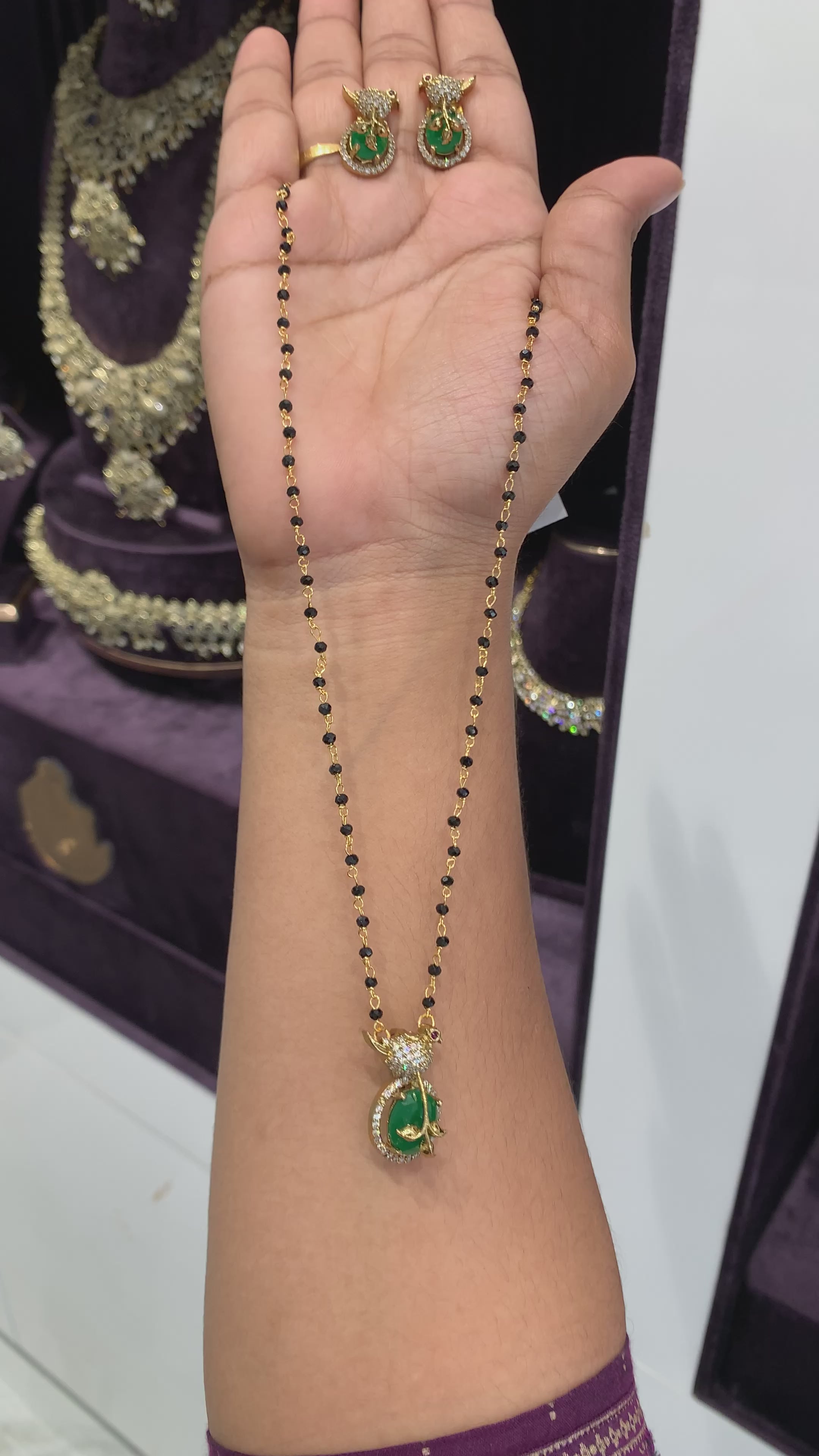 Beautiful Green stone Parrot Locket set with black beads