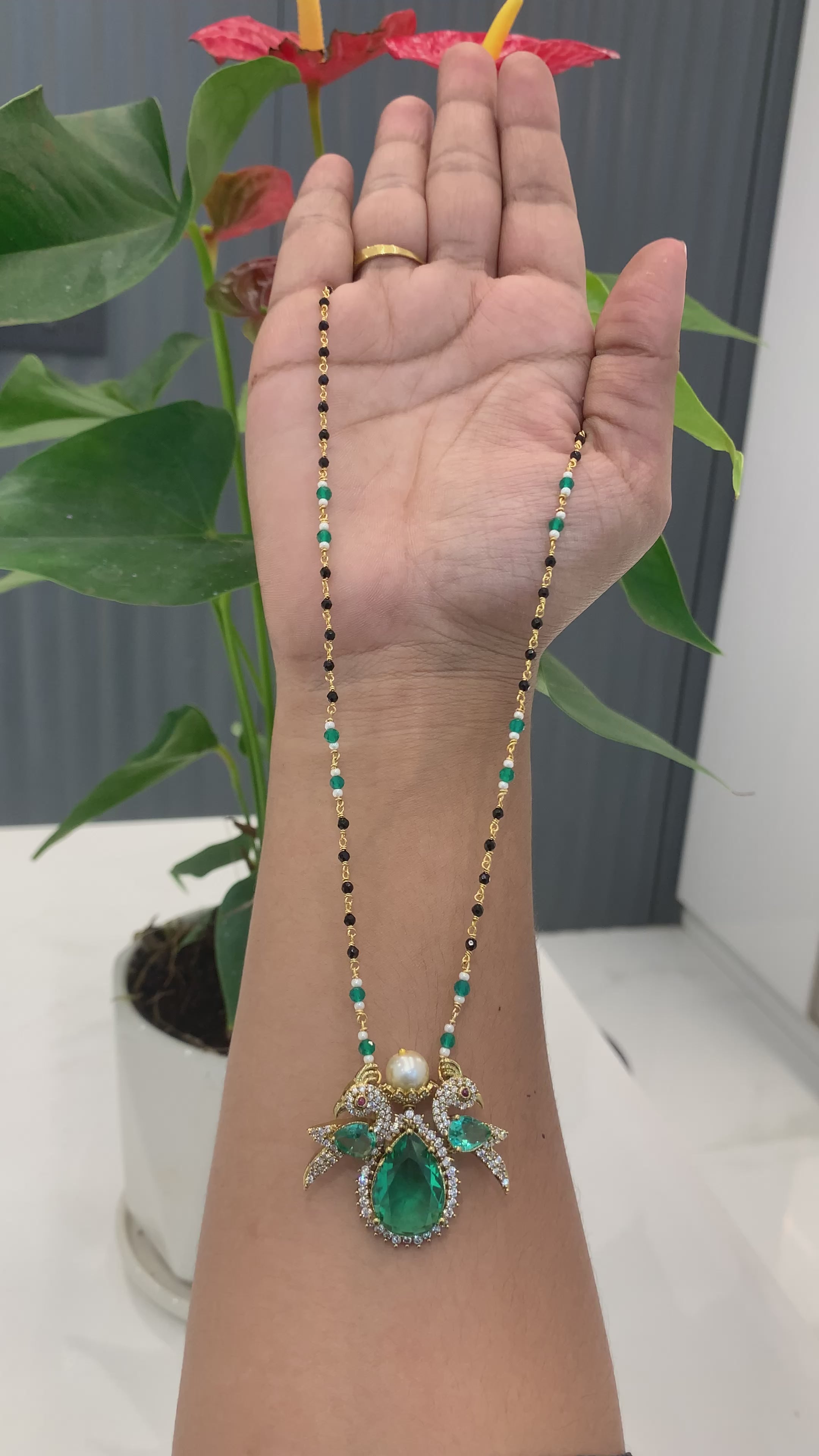 Beautiful peacock locket with black beads